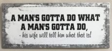 Tekstbord "A man's gotta do what a man's gotta do ... "